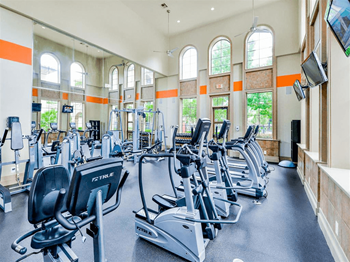 24-Hour fitness center with yoga and pilates studio